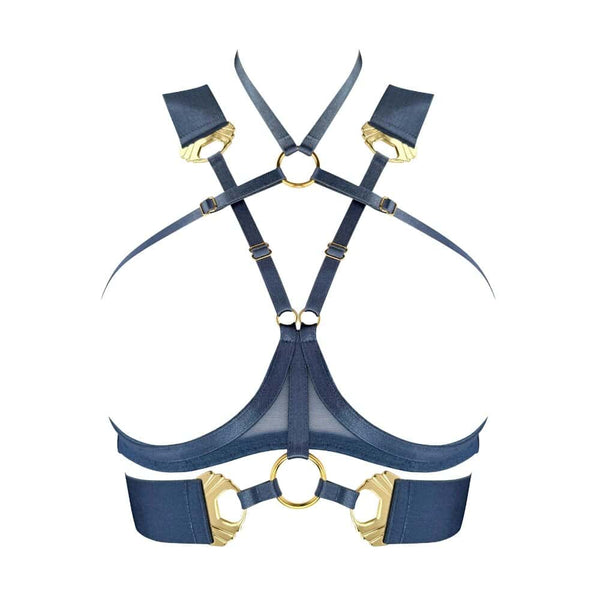 Ce modèle en édition saisonnière est décliné dans une teinte inédite : un bleu denim intense, contrasté par des finitions dorées à l’or 24 carats. L’anneau central et les multiples attaches métalliques renforcent la dimension bijou de cette création.