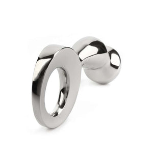 Plug anal DRANG en acier inoxydable poli avec base circulaire ergonomique, finition miroir, sélectionné par Brigade Mondaine Paris.
