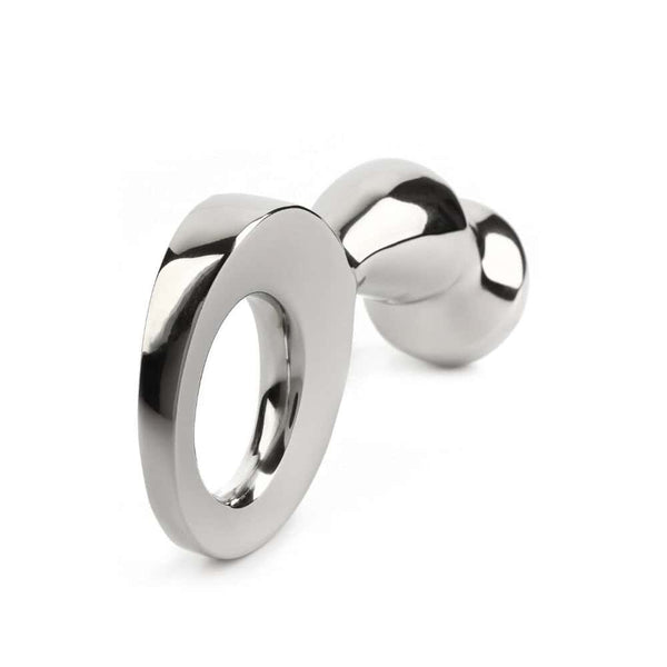 Plug anal DRANG en acier inoxydable poli avec base circulaire ergonomique, finition miroir, sélectionné par Brigade Mondaine Paris.