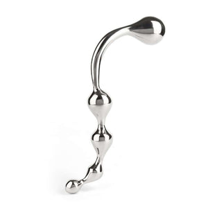 Wand Multi-Stim en acier inoxydable poli, forme incurvée avec extrémités sphériques, présenté sur fond blanc, sélection Brigade Mondaine Paris.