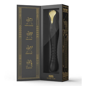 Stimulateur noir en silicone texturé avec finition dorée, présenté à la verticale sur fond sombre, proposé par Brigade Mondaine Sextoys Electriques Paris.