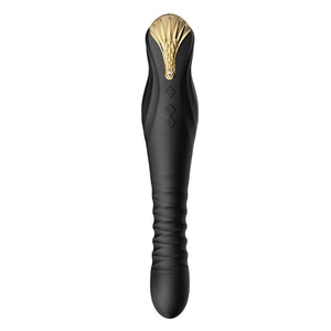Stimulateur noir en silicone texturé avec finition dorée, présenté à la verticale sur fond sombre, proposé par Brigade Mondaine Paris.