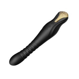 Stimulateur noir en silicone texturé avec finition dorée, présenté à la verticale sur fond sombre, proposé par Brigade Mondaine Paris.
