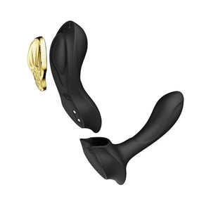 Vibromasseur portable de couleur noire avec détails dorés, design ergonomique et commandes intégrées, présenté sur fond blanc, sélection Brigade Mondaine Paris.