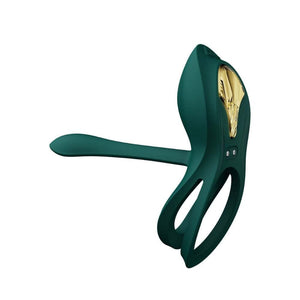 Vibromasseur portable au design ergonomique présenté avec son écrin, posé sur un décor aux nuances bleues et rouges, sélection Brigade Mondaine Paris. Sextoys Electriques