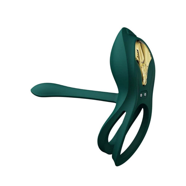 Vibromasseur portable au design ergonomique présenté avec son écrin, posé sur un décor aux nuances bleues et rouges, sélection Brigade Mondaine Paris. Sextoys Electriques