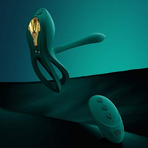 Vibromasseur portable au design ergonomique présenté avec son écrin, posé sur un décor aux nuances bleues et rouges, sélection Brigade Mondaine Paris. Sextoys Electriques