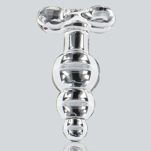 Plug anal en verre transparent à forme facettée avec base évasée, présenté sur fond clair, finition brillante, sélection Brigade Mondaine Paris.