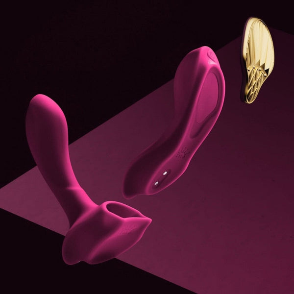 Vibromasseur portable de couleur prune avec détails dorés, design ergonomique et commandes intégrées, présenté sur fond blanc, sélection Brigade Mondaine Paris.