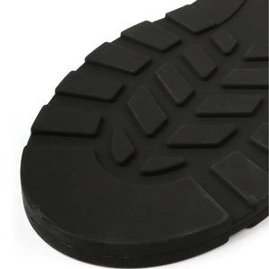 Paddle noire texturée avec poignée ergonomique et surface structurée, accessoire BDSM proposé par Brigade Mondaine Paris.