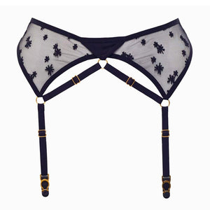Packshot du porte-jarretelles en résille noire orné de broderies étoilées avec de la tulle Française et de détails dorés plaqués or 24k sangles ajustables en tulle élastiques satinés