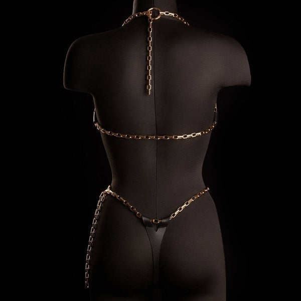 String ARIA IINFYNII en cuir noir avec chaînes dorées et symbole infini, pièce minimaliste et graphique, sélection Brigade Mondaine Paris