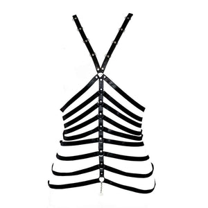 Harnais LALITA en lanières noires avec anneaux en métal, créant un effet structuré et audacieux. Ce modèle met en valeur la silhouette avec une touche de sophistication, présenté sur un fond blanc.