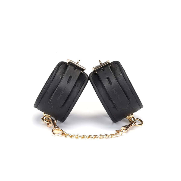 Packshot Menottes en Cuir Noir et Chaîne Or
