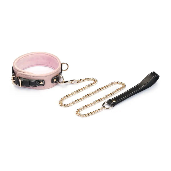 Set collier et menottes LIEBE SEELE en cuir de vache italien rose pâle, noir et doré, reliés par une chaîne dorée. Confort optimal pour les jeux de soumission élégants et raffinés.