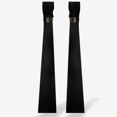 Paire de manchettes longues QRUCIFIX noires avec finitions métalliques dorées et lignes épurées, présentées sur fond blanc par Brigade Mondaine Paris.