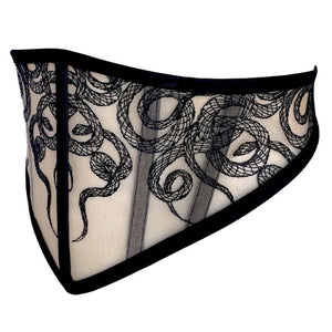 Corset Aspidis VIDE NOIR présenté chez Brigade Mondaine Paris, mesh nude brodé de motifs noirs serpentins, coupe ajustée et finitions graphiques, photographié en studio.