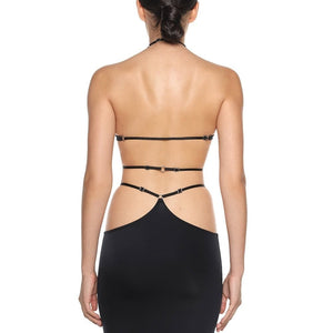 Jupe longue en biflex fluide et extensible signée Anoeses, ornée d’anneaux métalliques et dotée d’une fente haute ajustable – création artisanale et sensuelle.