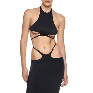Ensemble Stellare Anoeses composé d’un top dos nu à bretelles réglables et d’une jupe fendue en biflex fluide – design graphique, anneaux métalliques, coupe sensuelle et fabrication artisanale.
