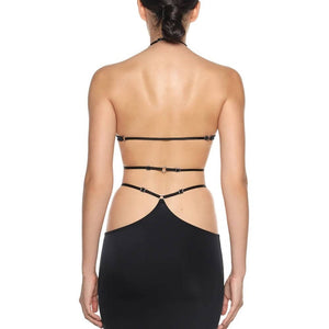 Ensemble Stellare Anoeses composé d’un top dos nu à bretelles réglables et d’une jupe fendue en biflex fluide – design graphique, anneaux métalliques, coupe sensuelle et fabrication artisanale.