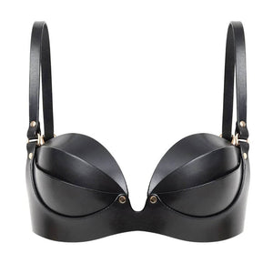Soutien-gorge ANOESIS en cuir noir avec armatures, sangles réglables et finitions métalliques dorées, porté avec un string assorti sur fond blanc.