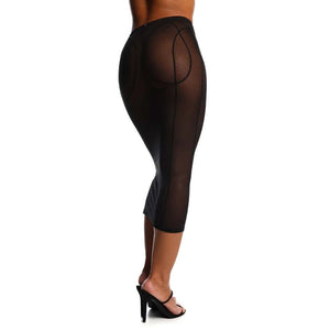 Jupe fendue en tulle noir ANOESES portée par un modèle féminin debout, coupe midi ajustée avec fente centrale et lignes structurées, transparence légère et esthétique fétiche haut de gamme Brigade Mondaine Paris.