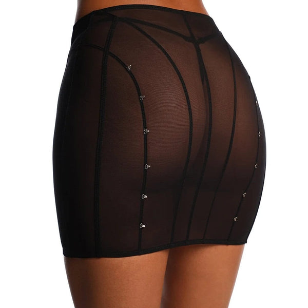 Vue dos d’une jupe en tulle noir ANOESES, coupe ajustée avec lignes graphiques verticales et petits crochets décoratifs, transparence légère et esthétique fétiche haut de gamme Brigade Mondaine Paris.