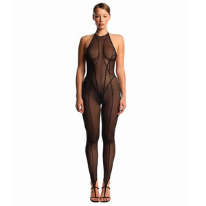Vue dos d’un bodysuit en tulle noir ANOESES, dos ouvert, coupe échancrée et manches longues transparentes, porté par un modèle féminin dans une esthétique fétiche haut de gamme Brigade Mondaine Paris.