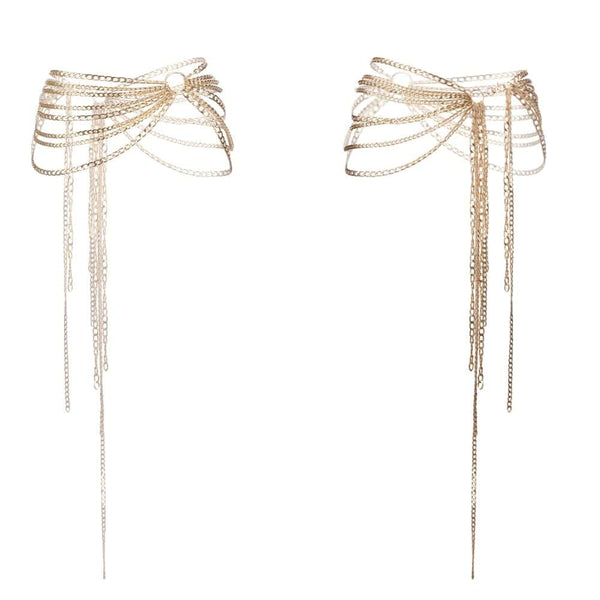 Harnais bijou de corps composé de deux harnais : un harnais ajustable de type soutien-gorge ouvert à poser sur le buste et d’une ceinture jupe à poser sur les hanches, habillant le corps d’une structure élégante et audacieuse. Design ajustable pour un confort optimal à porter seul ou en superposition