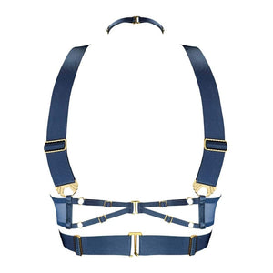 Ce modèle en édition saisonnière est décliné dans une teinte inédite : un bleu denim intense, contrasté par des finitions dorées à l’or 24 carats. L’anneau central et les multiples attaches métalliques renforcent la dimension bijou de cette création.