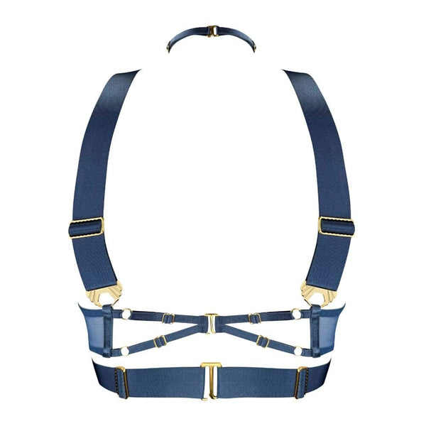 Ce modèle en édition saisonnière est décliné dans une teinte inédite : un bleu denim intense, contrasté par des finitions dorées à l’or 24 carats. L’anneau central et les multiples attaches métalliques renforcent la dimension bijou de cette création.