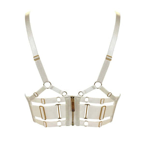Soutien-gorge BORDELLE Signature Cream vu de face, en tulle transparent ivoire avec bandes elastiques structurantes et finitions métalliques dorées, présenté chez Brigade Mondaine Paris.