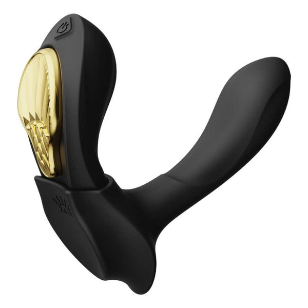Vibromasseur portable de couleur noire avec détails dorés, design ergonomique et commandes intégrées, présenté sur fond blanc, sélection Brigade Mondaine Paris.