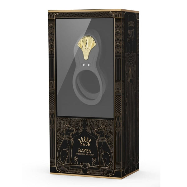 Vibromasseur portable au design ergonomique présenté avec son écrin, posé sur un décor aux nuances bleues et rouges, sélection Brigade Mondaine Paris. Sextoys Electriques