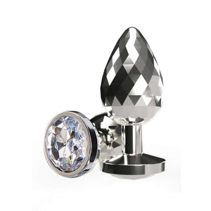 Plug anal en métal poli avec cristal facetté transparent, base évasée et finition brillante, présenté par Brigade Mondaine Paris.