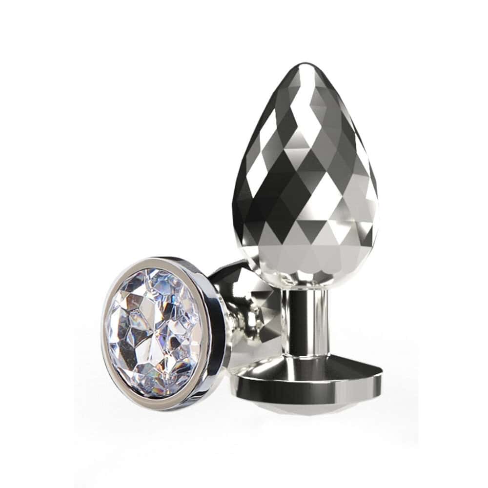 Plug anal en métal poli avec cristal facetté transparent, base évasée et finition brillante, présenté par Brigade Mondaine Paris.