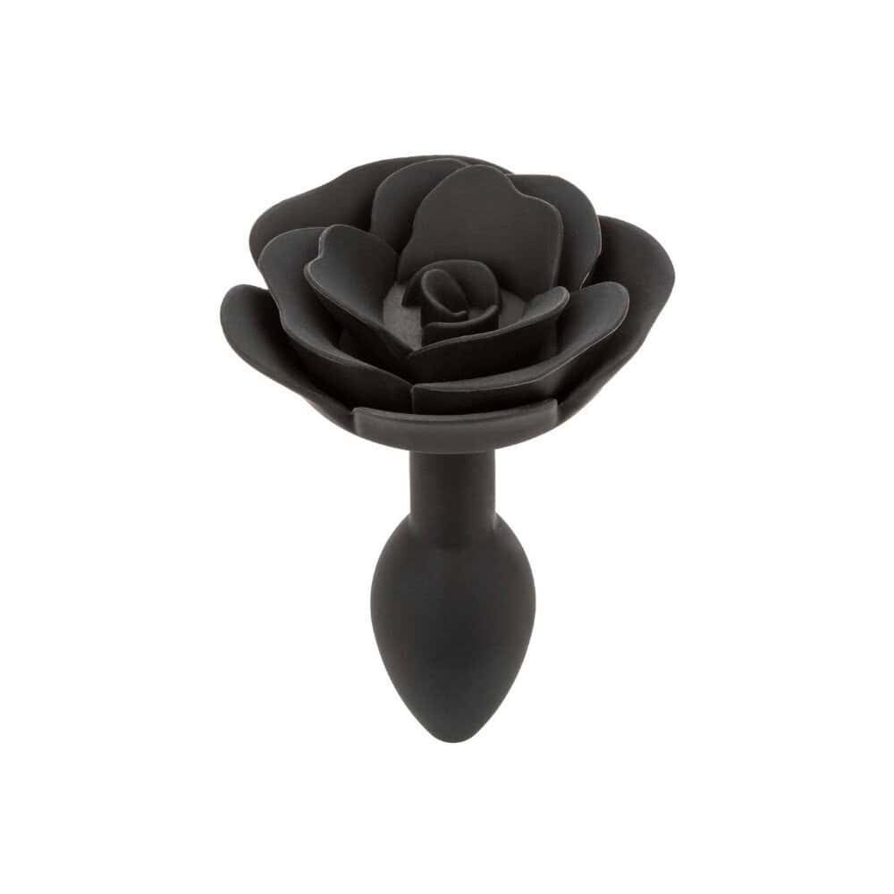 Plug anal noir en silicone mat, tête sculptée en forme de rose avec base évasée, présenté par Brigade Mondaine Paris.