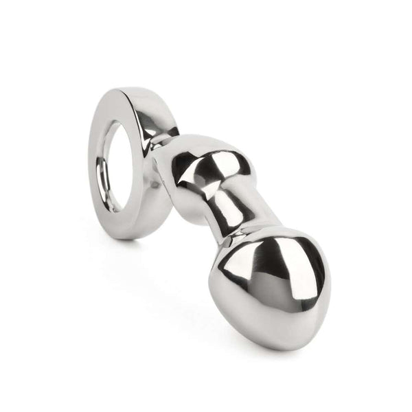 Plug anal DRANG en acier inoxydable poli avec base circulaire ergonomique, finition miroir, sélectionné par Brigade Mondaine Paris.