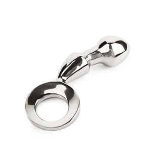 Plug anal DRANG en acier inoxydable poli avec base circulaire ergonomique, finition miroir, sélectionné par Brigade Mondaine Paris.