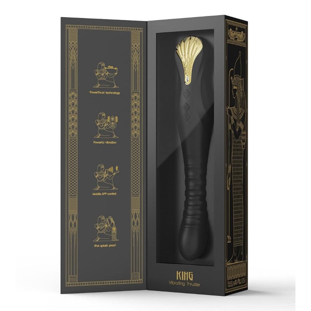 Stimulateur noir en silicone texturé avec finition dorée, présenté à la verticale sur fond sombre, proposé par Brigade Mondaine Sextoys Electriques Paris.