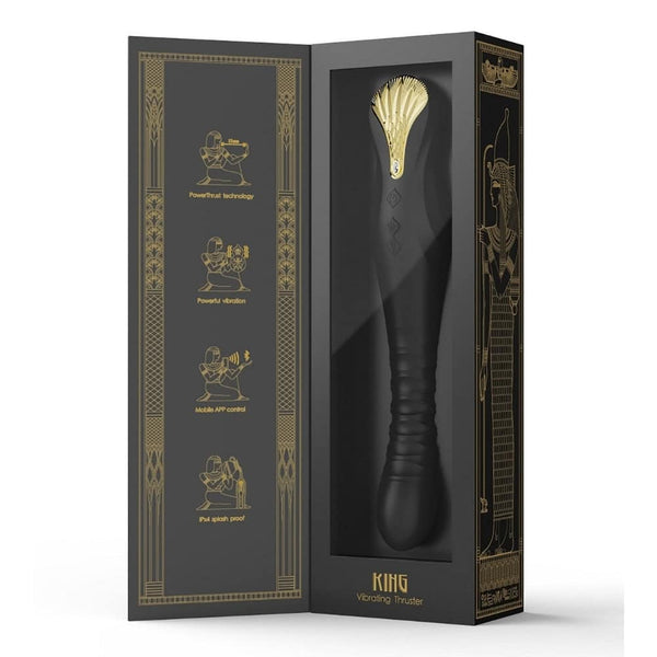 Stimulateur noir en silicone texturé avec finition dorée, présenté à la verticale sur fond sombre, proposé par Brigade Mondaine Sextoys Electriques Paris.