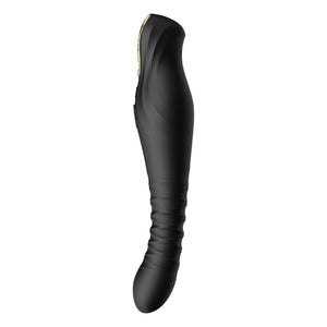 Stimulateur noir en silicone texturé avec finition dorée, présenté à la verticale sur fond sombre, proposé par Brigade Mondaine Paris.