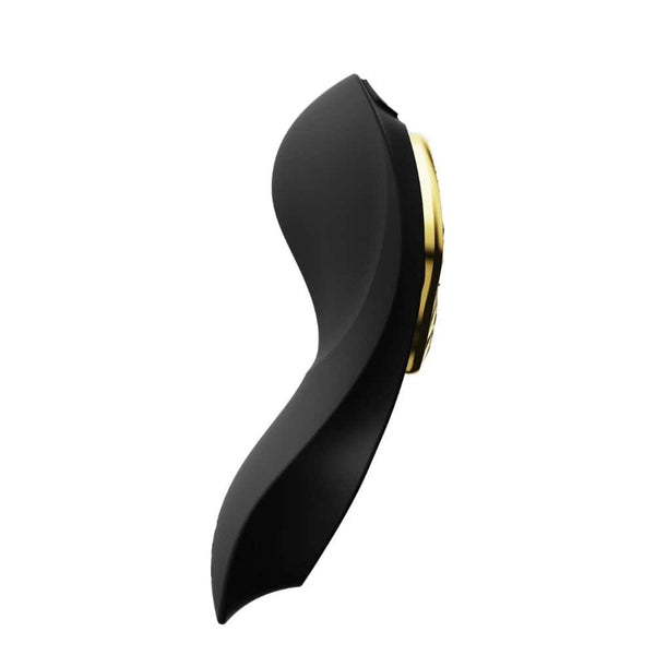 Vibromasseur portable de couleur noire avec détails dorés, design ergonomique et commandes intégrées, présenté sur fond blanc, sélection Brigade Mondaine Paris.