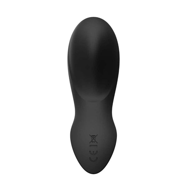 Vibromasseur portable de couleur noire avec détails dorés, design ergonomique et commandes intégrées, présenté sur fond blanc, sélection Brigade Mondaine Paris.