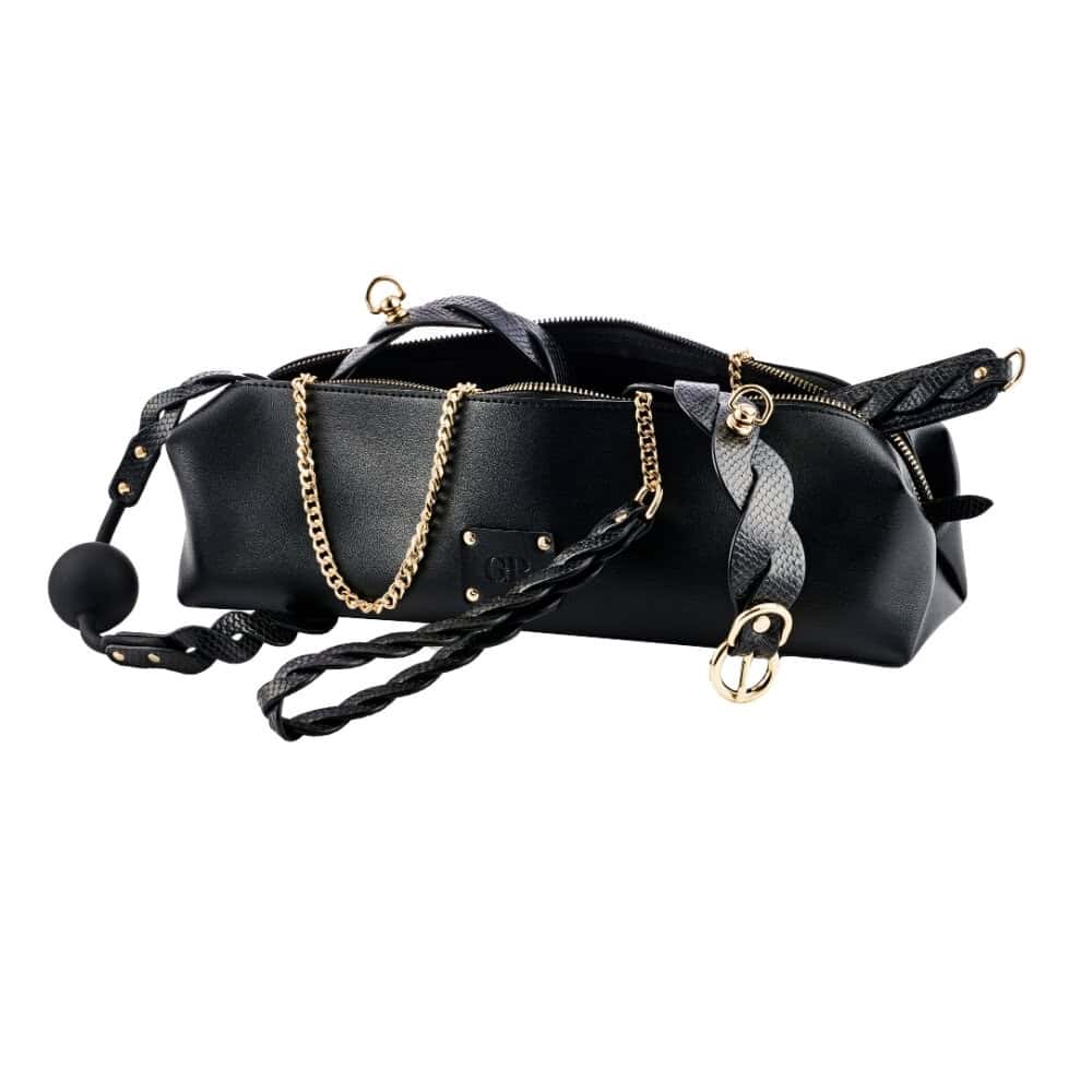 Trousse de rangement en cuir noir avec fermeture zippée et détails raffinés, accessoire de rangement sélectionné par Brigade Mondaine Paris.