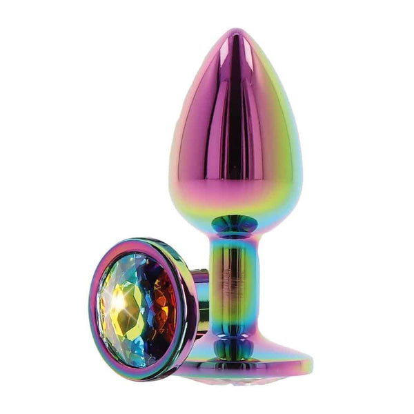 Plug anal en cristal irisé multicolore, à la forme arrondie et lisse, doté d’une base facettée brillante, présenté sur fond blanc dans une esthétique épurée et élégante.