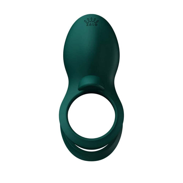 Vibromasseur portable au design ergonomique présenté avec son écrin, posé sur un décor aux nuances bleues et rouges, sélection Brigade Mondaine Paris. Sextoys Electriques