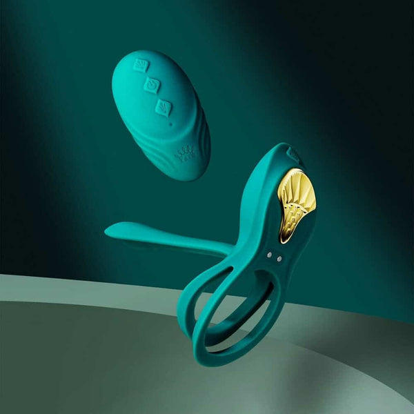 Vibromasseur portable au design ergonomique présenté avec son écrin, posé sur un décor aux nuances bleues et rouges, sélection Brigade Mondaine Paris. Sextoys Electriques