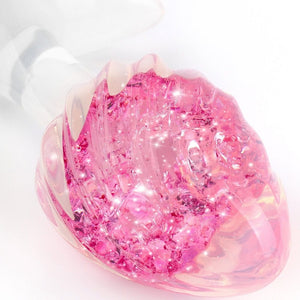 Plug en cristal translucide avec base évasée et texture interne brillante, accessoire proposé par Brigade Mondaine Paris.