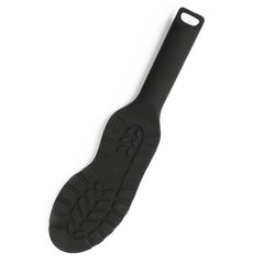 Paddle noire texturée avec poignée ergonomique et surface structurée, accessoire BDSM proposé par Brigade Mondaine Paris.